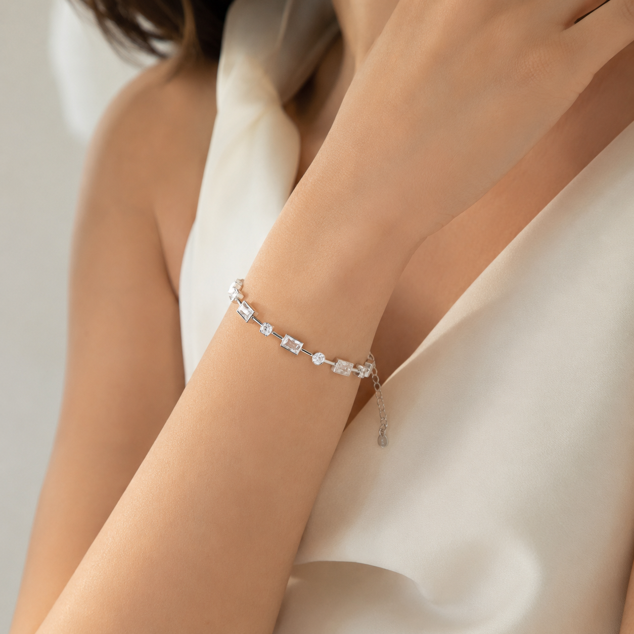 Sleek Rectangular Designed Silver Bracelet Adorned With Round Diamonds