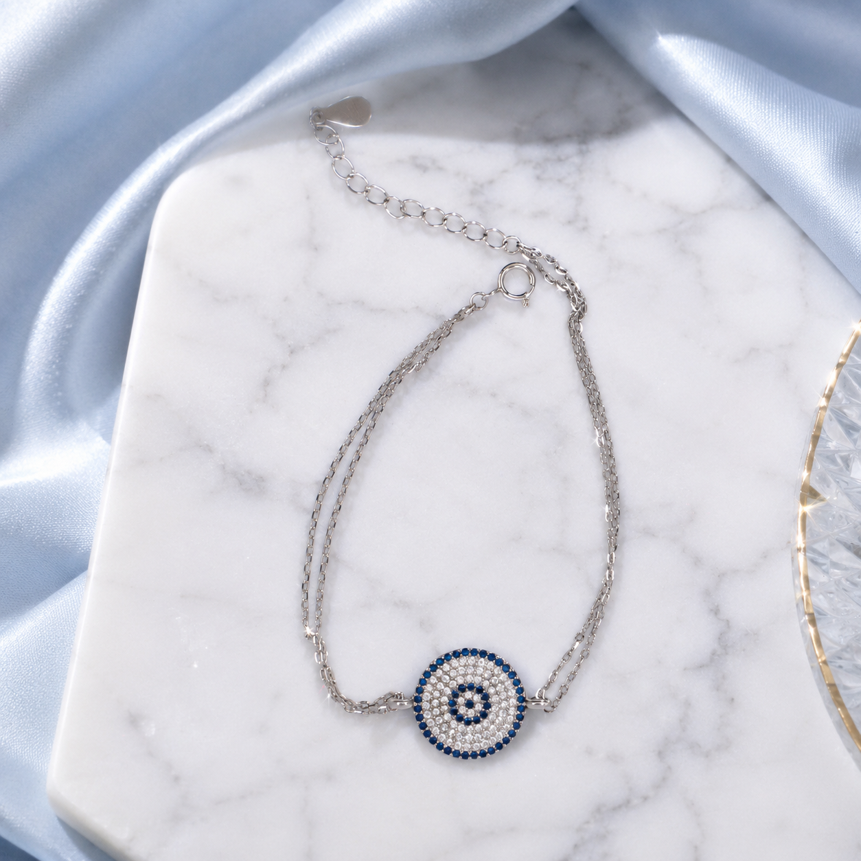 Crafted in Sterling Silver with radiant Blue & White Diamonds